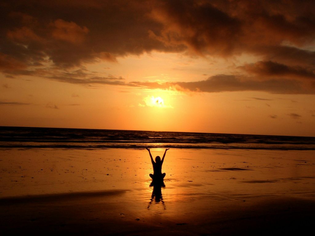 pexels-photo-268134-268134 Peaceful meditation silhouette at sunset on a serene beach.